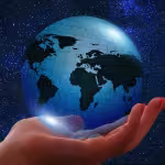 Globe held in a hand demonstrating the important role social impact PR plays in a communications strategy
