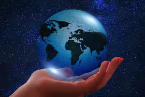 Globe held in a hand demonstrating the important role social impact PR plays in a communications strategy