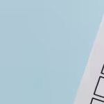 A checklist with a red checkmark symbolising a completed task on a pastel blue background