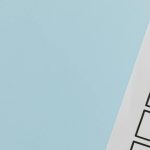 Cannon PR Survey | Cannon PR A checklist with a red checkmark symbolising a completed task on a pastel blue background