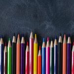 pexelsphoto28369552836955 | Cannon PR Vibrant colored pencils arranged on a chalkboard background for art projects