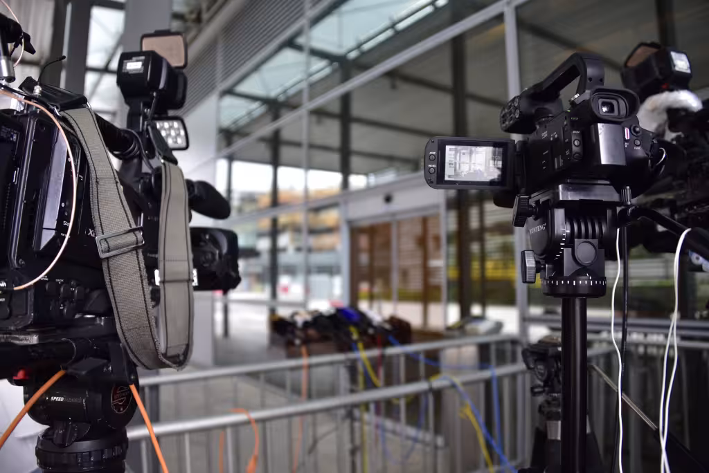 Media relations depicted by showing tv cameras